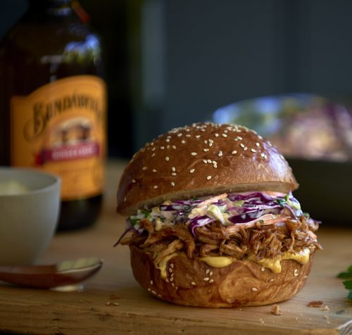 Burger at the front of Bundaberg beer